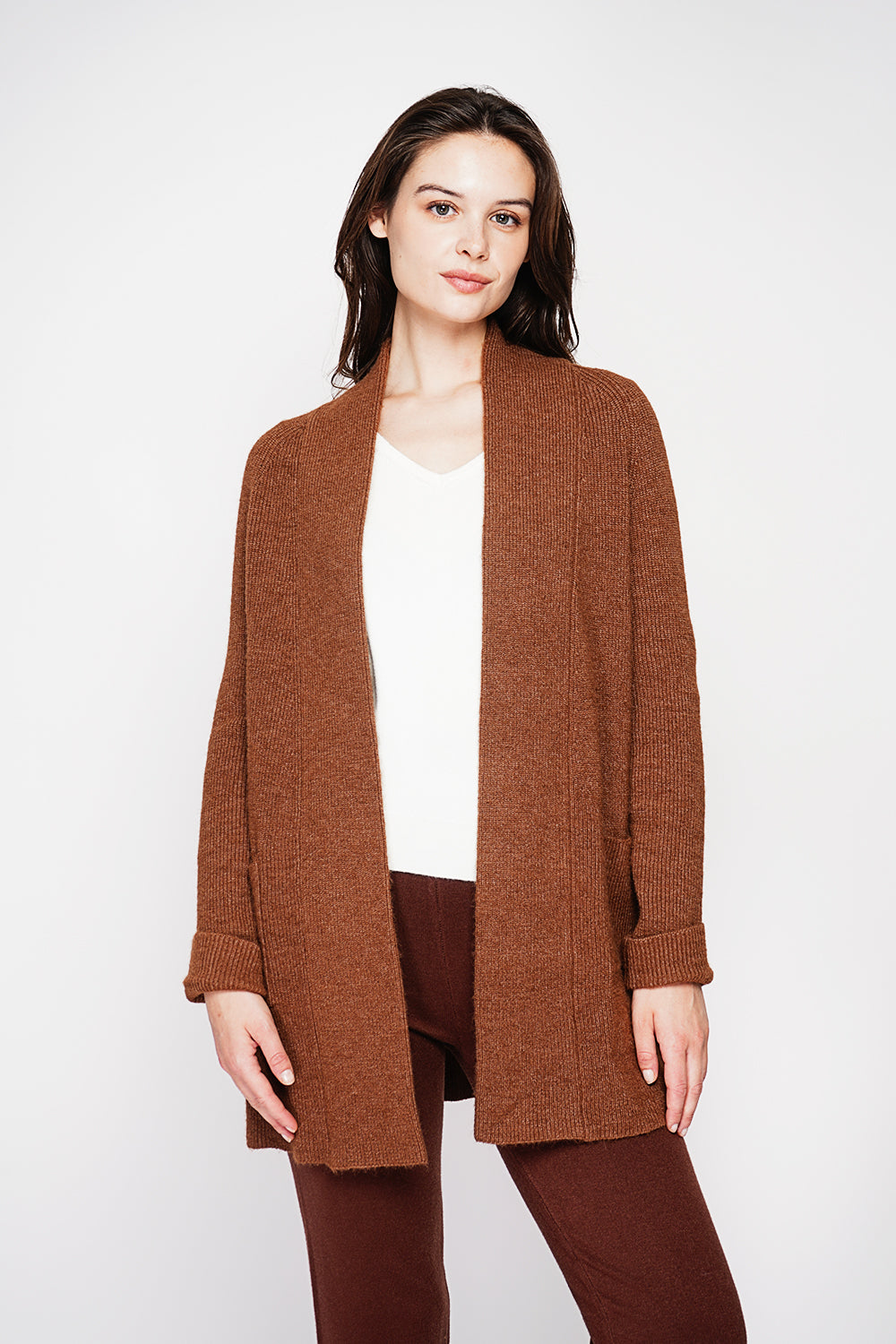 Long shawl collar cardigan with double patch pockets on the front, long sleeves and turned-in cuffs