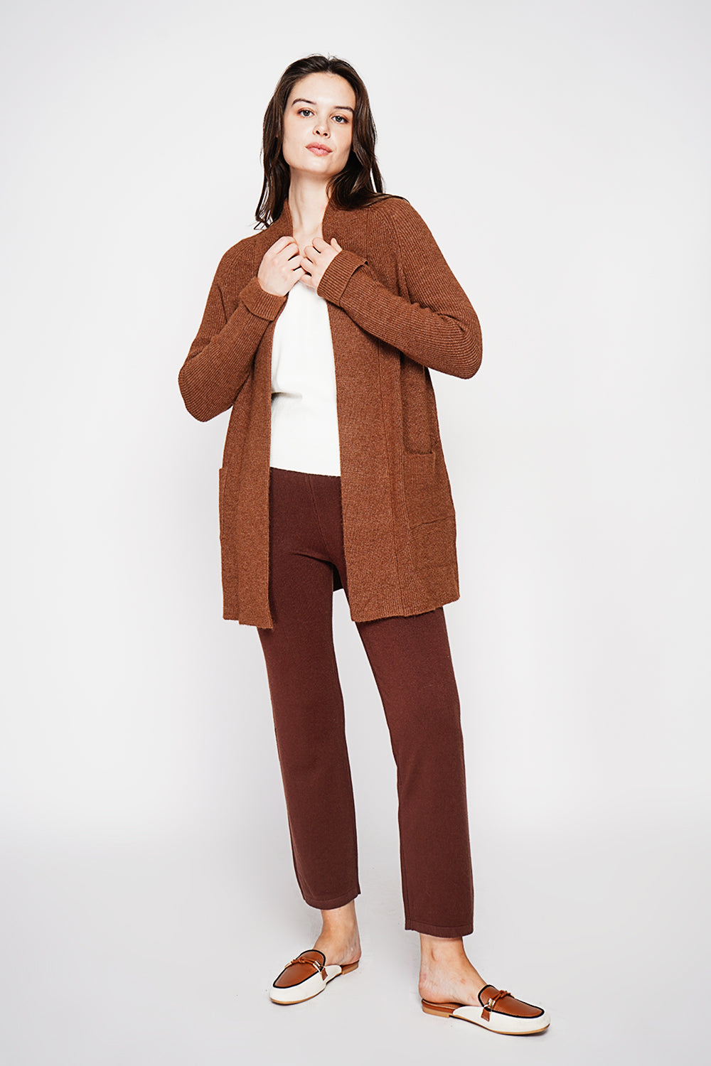 Long shawl collar cardigan with double patch pockets on the front, long sleeves and turned-in cuffs