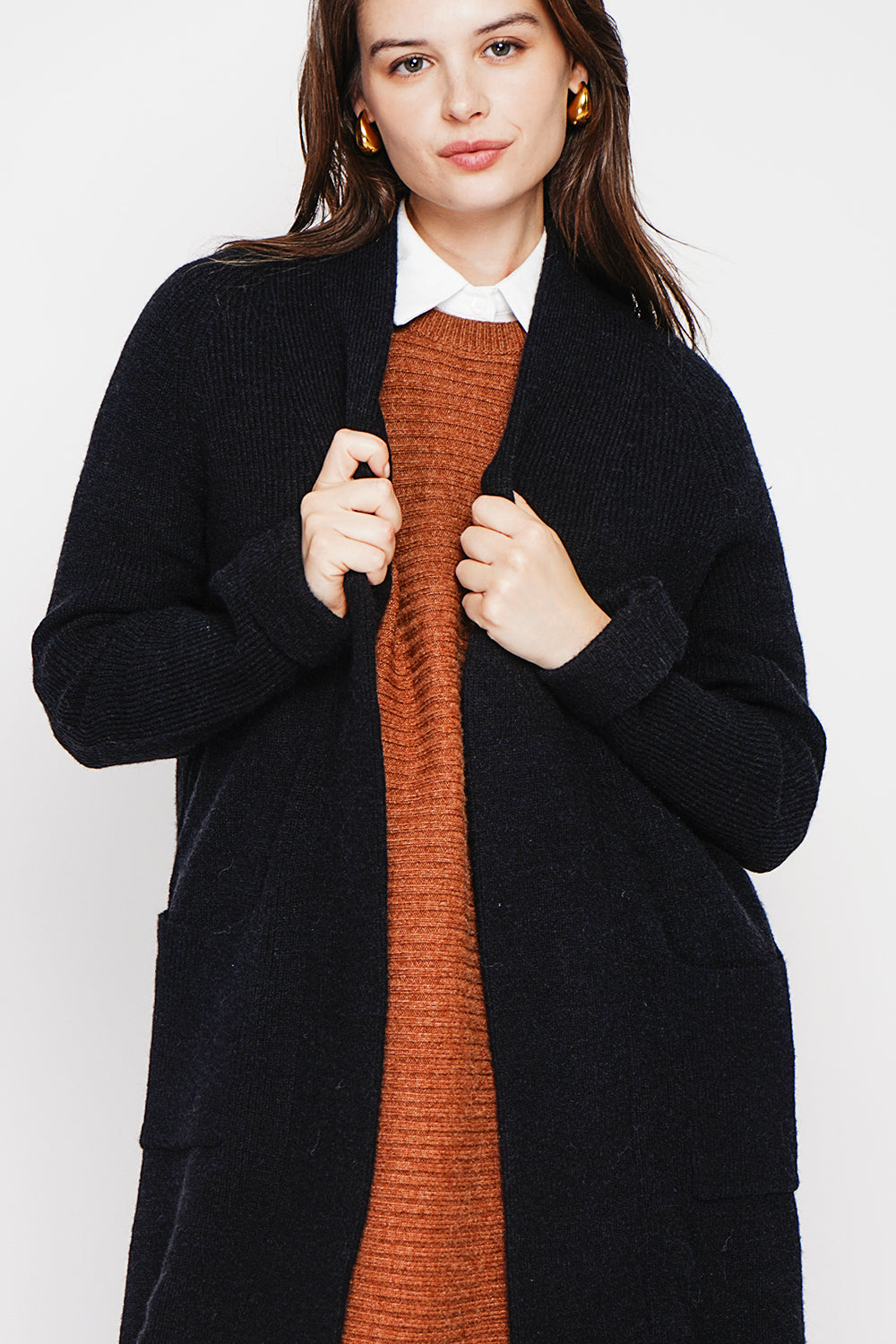 Long shawl collar cardigan with double patch pockets on the front, long sleeves and turned-in cuffs