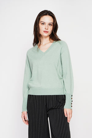 Oversized V-neck sweater with button placket at the bottom of the long sleeves