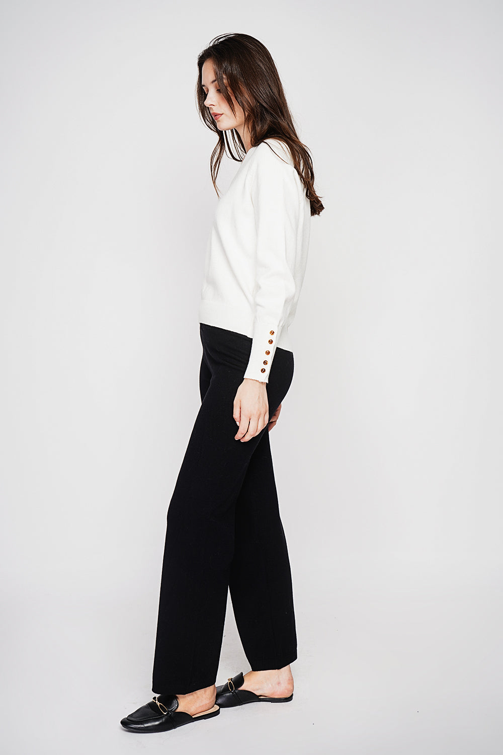 Oversized V-neck sweater with button placket at the bottom of the long sleeves