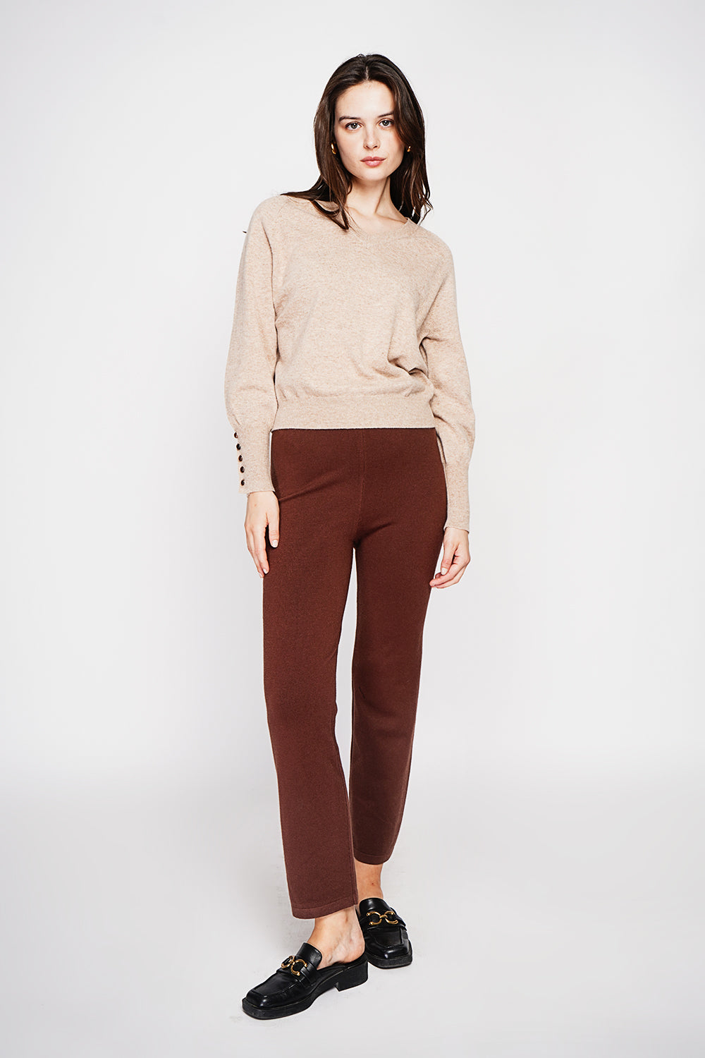 Oversized V-neck sweater with button placket at the bottom of the long sleeves