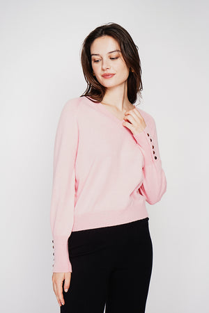 Oversized V-neck sweater with button placket at the bottom of the long sleeves