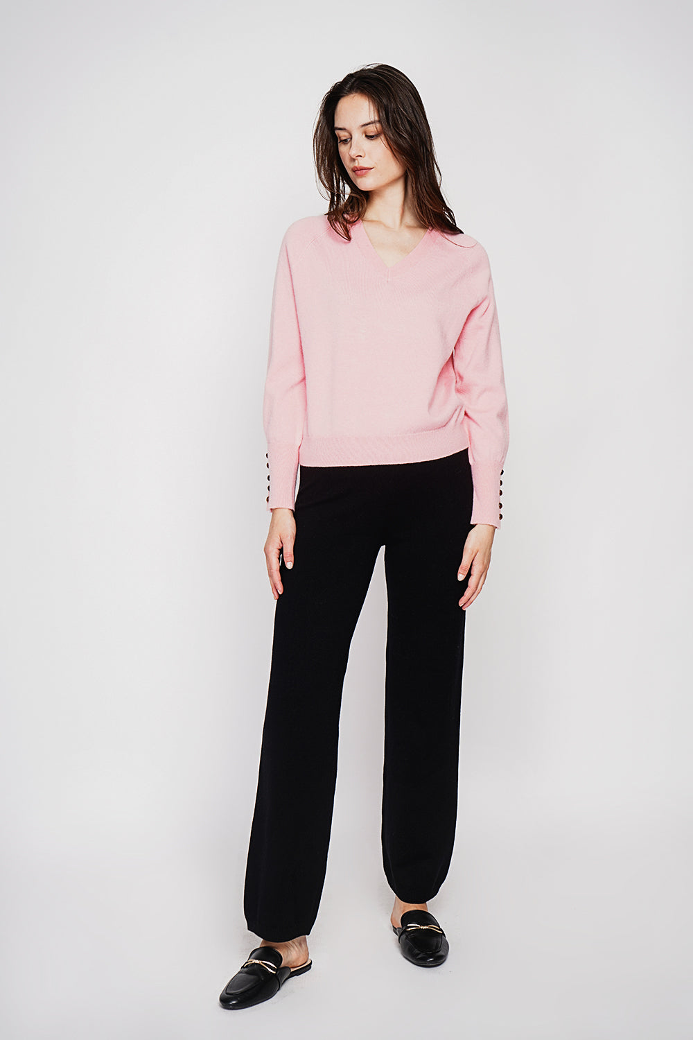 Oversized V-neck sweater with button placket at the bottom of the long sleeves