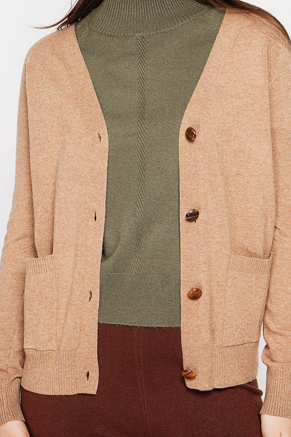 Fancy buttoned v-neck oversized fit vest with long sleeve pockets