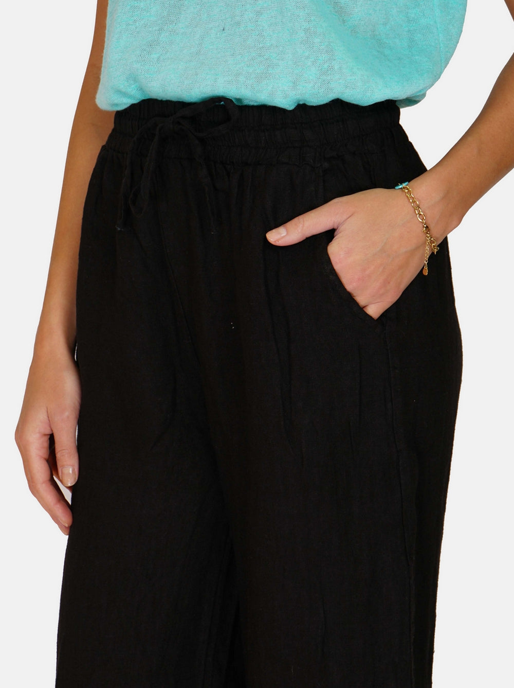 Pants in elastic and lacy high waist, pockets on the sides