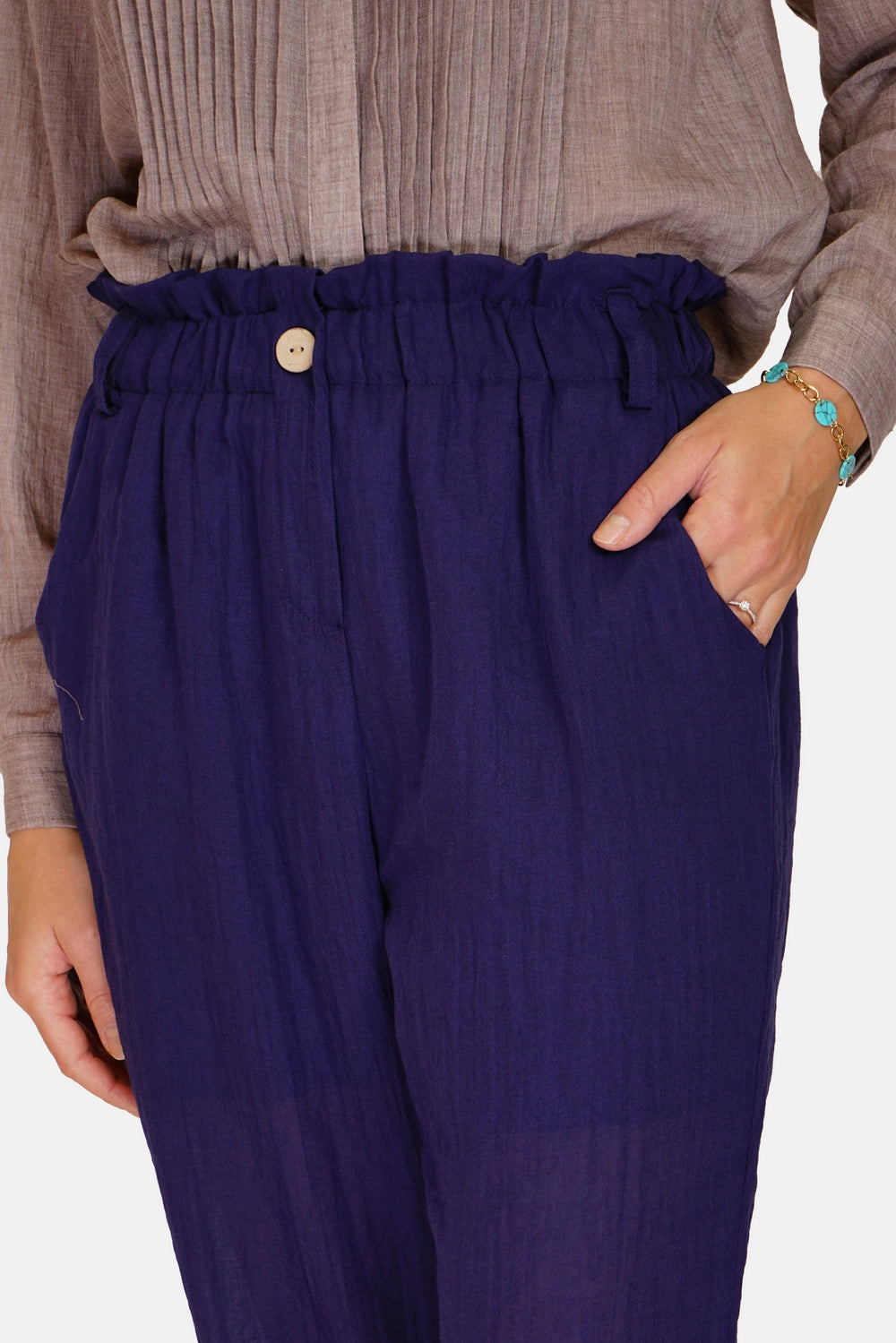 Trousers with pockets on the sides, buttons on the front, high waist