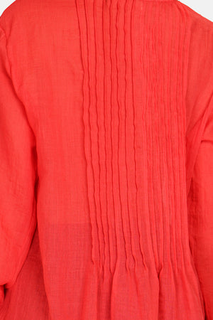 Tunic with mandarin collar, folded front, buttoned, long sleeves