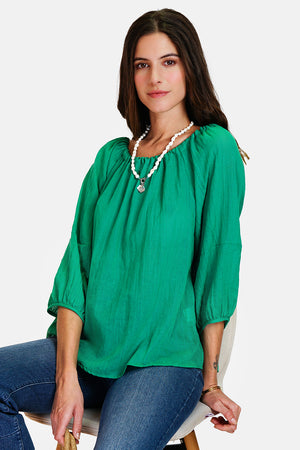 Wide top with lace at the round neck with 3/4 sleeves