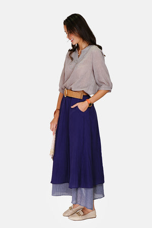 Long skirt with front pockets lined in bi-color