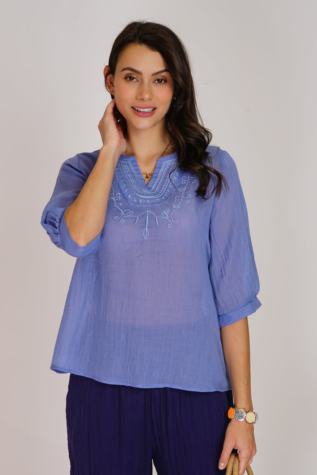 Fancy embroidered trapeze front top with mid-length sleeves