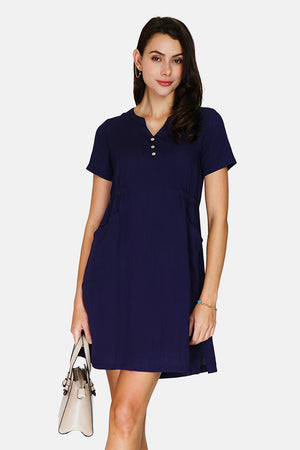 Dress with Tunisian collar, front buttons and pockets, short sleeves