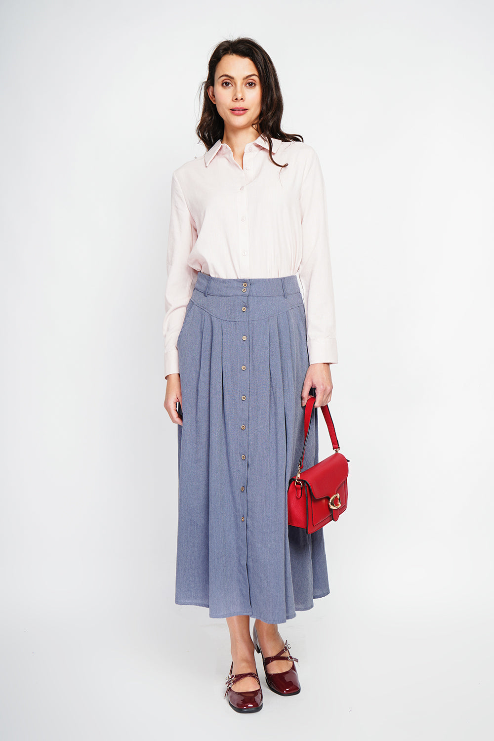 Long flared skirt with buttoned front and side pockets