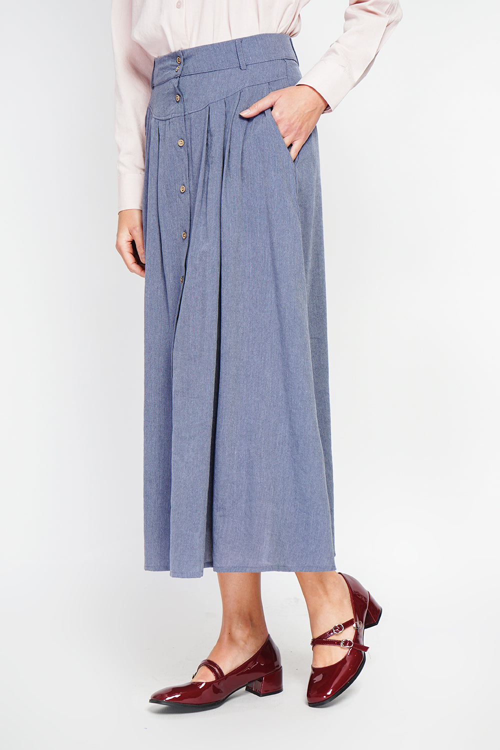 Long flared skirt with buttoned front and side pockets