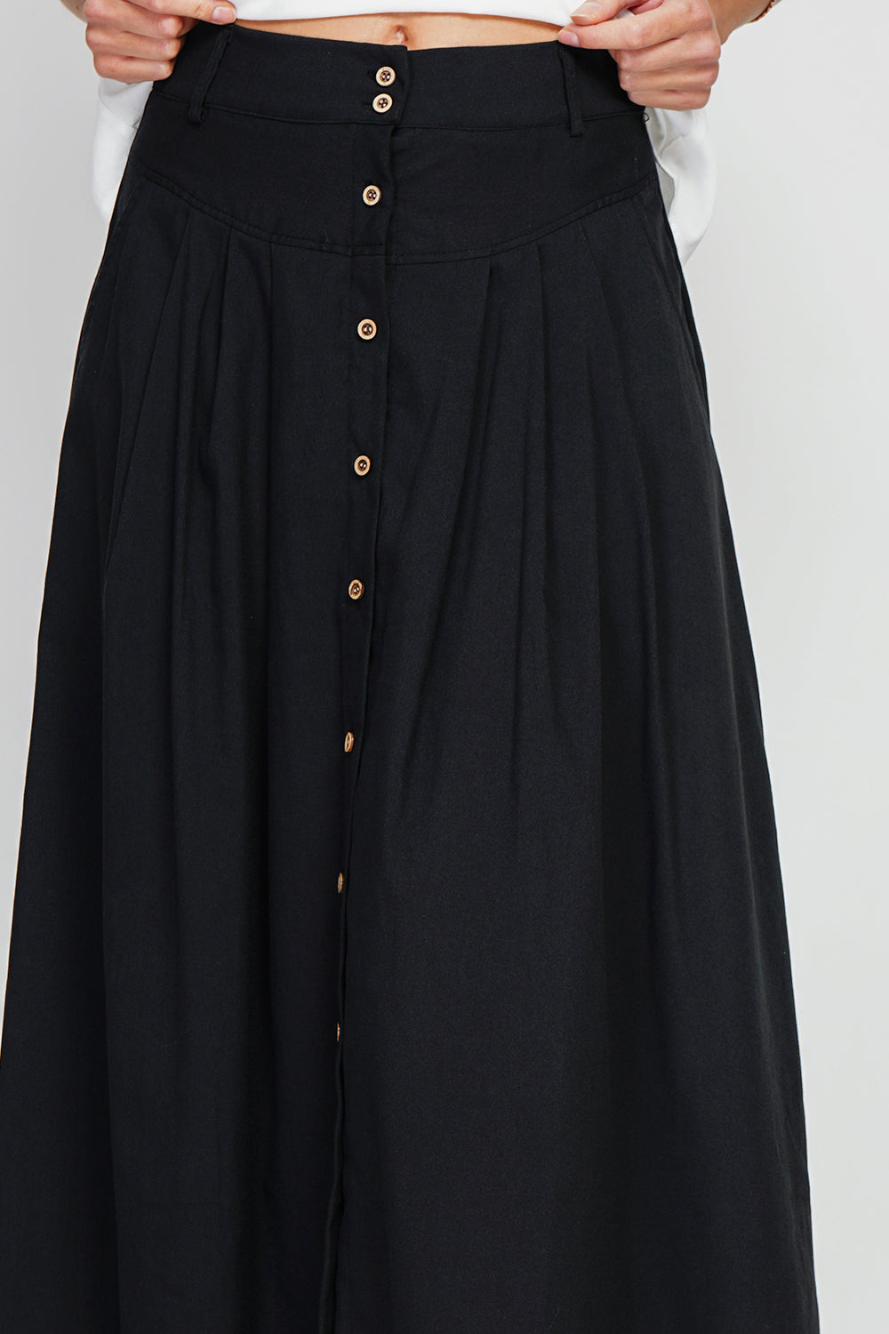 Long flared skirt with buttoned front and side pockets