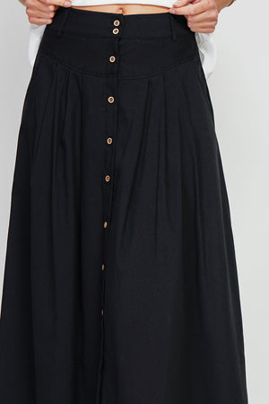 Long flared skirt with buttoned front and side pockets