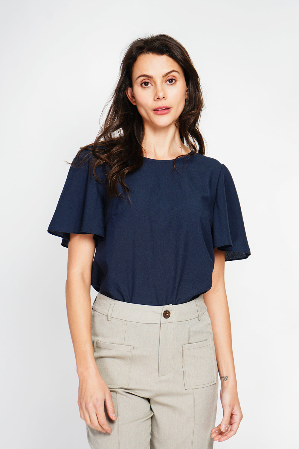 Round neck top with back slit and button closure and short sleeves