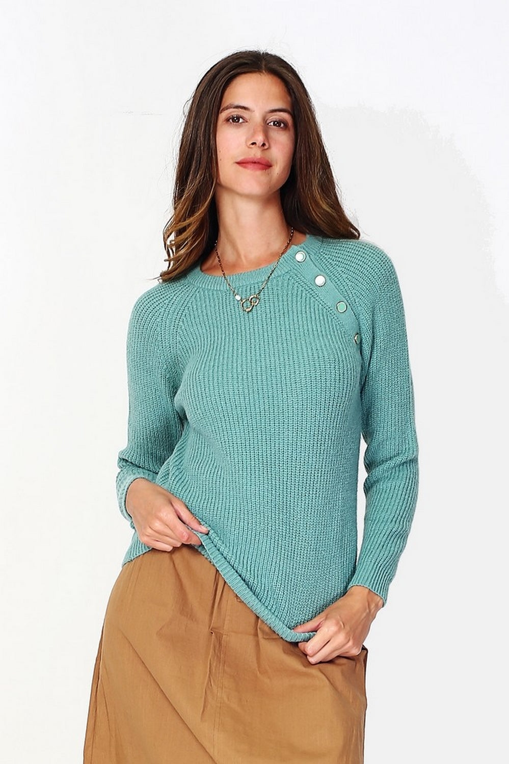 High neck sweater closed by a shoulder button placket, pearl rib knitting