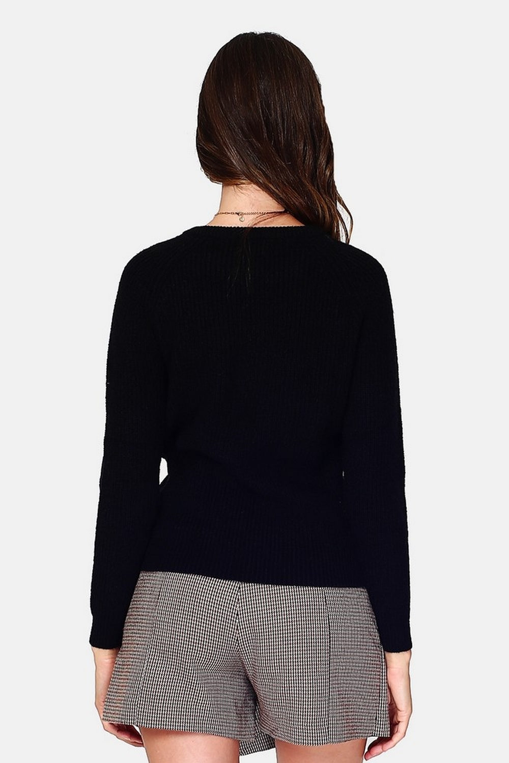 High neck sweater closed by a shoulder button placket, pearl rib knitting