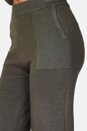 Hoch taillierte Strickhose, breiter Saum mit Taschen