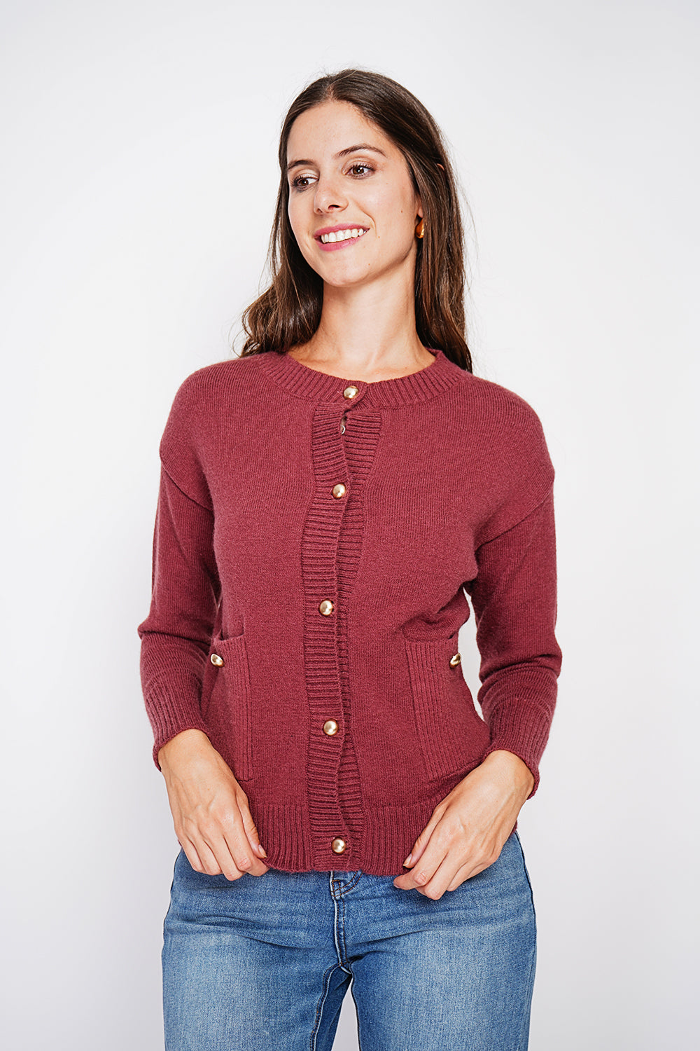 Crew neck vest with fancy buttoned front pockets and long sleeves