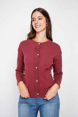 Crew neck vest with fancy buttoned front pockets and long sleeves
