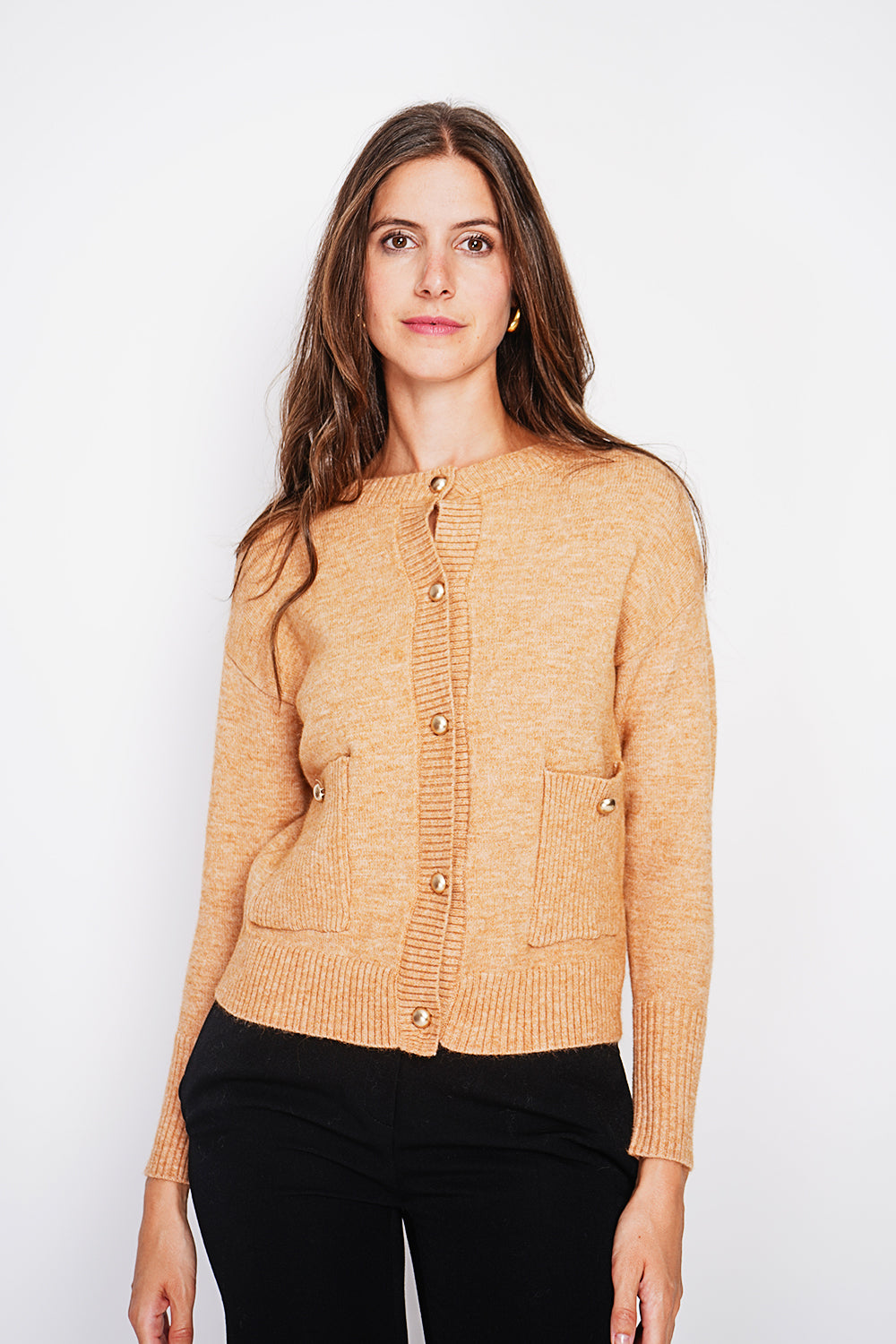 Crew neck vest with fancy buttoned front pockets and long sleeves