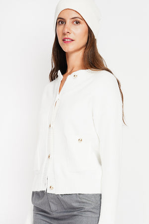 Crew neck vest with fancy buttoned front pockets and long sleeves