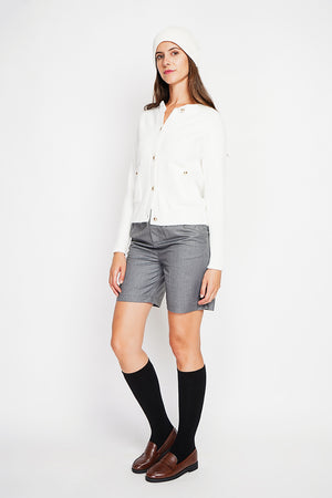 Crew neck vest with fancy buttoned front pockets and long sleeves