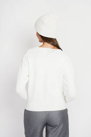 Crew neck vest with fancy buttoned front pockets and long sleeves