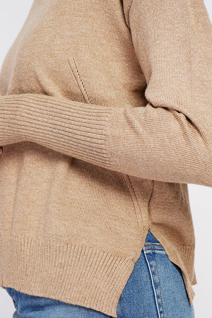 Oversized turtleneck sweater with openwork front and long sleeves