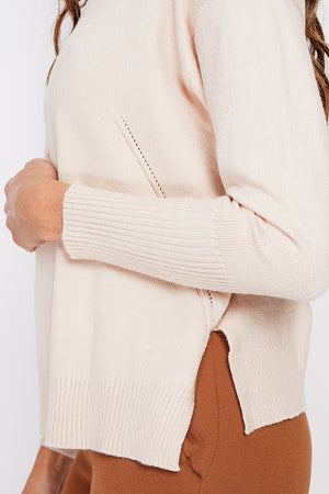 Oversized turtleneck sweater with openwork front and long sleeves