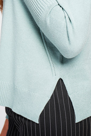 Oversized turtleneck sweater with openwork front and long sleeves