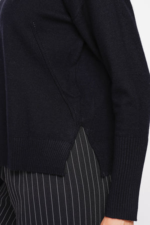 Oversized turtleneck sweater with openwork front and long sleeves