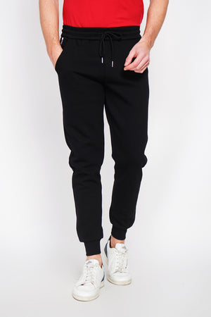 Slim fit jogging pants with drawstring and flat pocket with zip