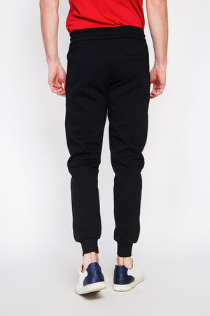 Slim fit jogging pants with drawstring and flat pocket with zip