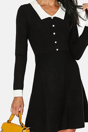 Black dress with white collar pearl buttons in front