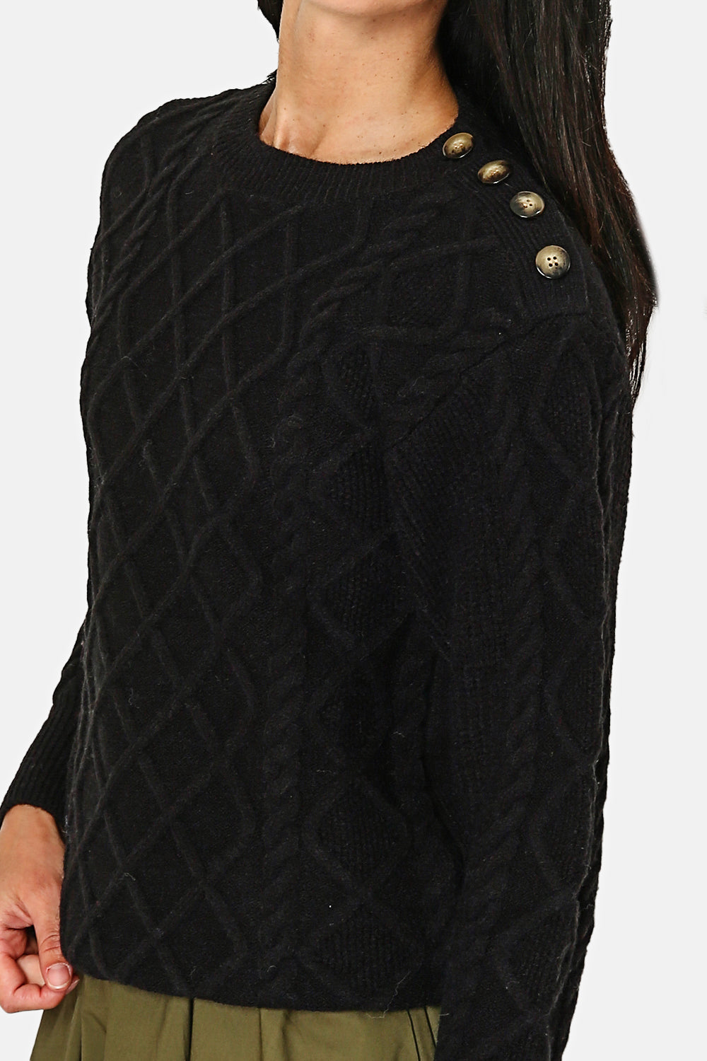Slightly high neck sweater with fancy buttons on the shoulder