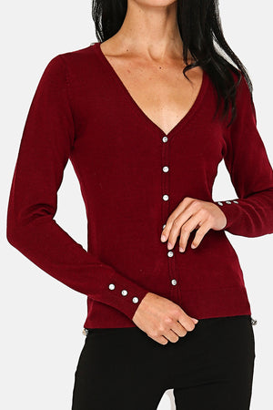 V-neck cardigan with diamond buttoning and buttons on 2-ply sleeves