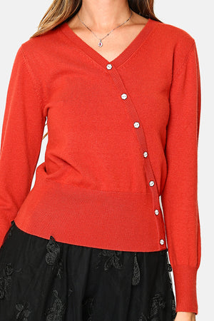 V-neck sweater, crossed with fancy buttons on the front